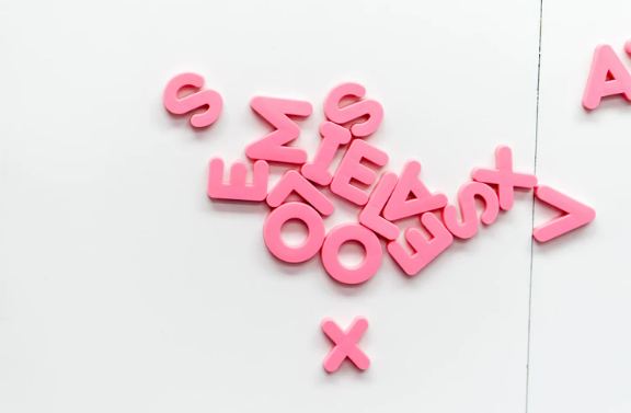 Jumbled pink letters