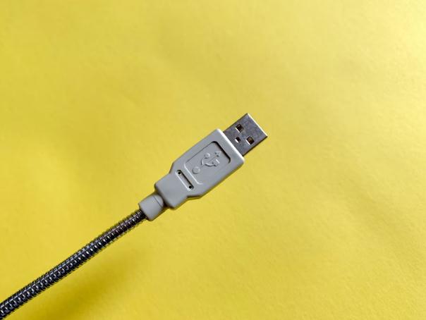 A-USB-A-cord-against-a-yellow-background