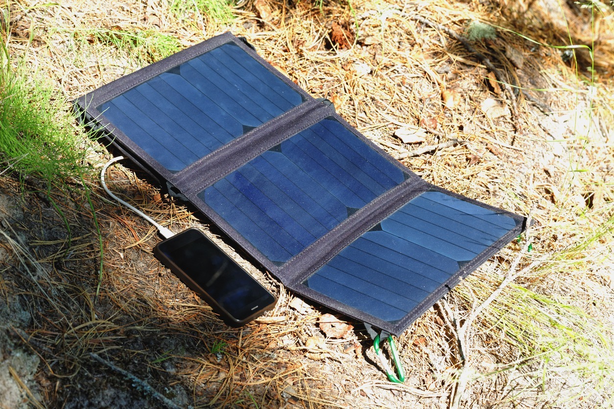 phone-charging-from-a-foldable-solar-charger