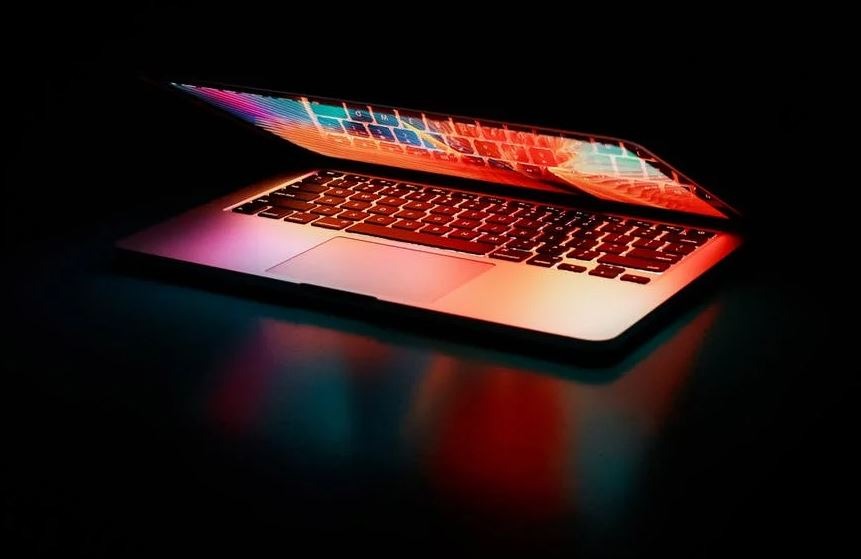 semi-opened-laptop-computer-turned-on-on-table