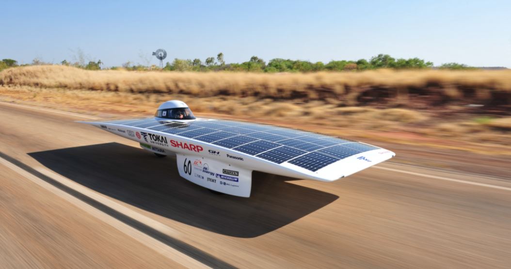 white-solar-car-on-the-road